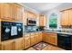 Kitchen featuring wood cabinets, stainless steel appliances, and granite countertops at 4103 Devon Wood Ne Dr, Marietta, GA 30066