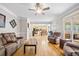 Inviting living room with hardwood floors and views into the kitchen and screened in porch at 4103 Devon Wood Ne Dr, Marietta, GA 30066