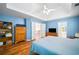 Light-filled primary bedroom featuring hardwood floors and trey ceilings at 4103 Devon Wood Ne Dr, Marietta, GA 30066