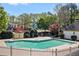 Community pool surrounded by a fence, with lush greenery and beautiful landscaping at 4103 Devon Wood Ne Dr, Marietta, GA 30066