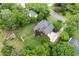 Aerial view of a landscaped backyard with mature trees, deck, and play structure at 434 Shepard Sw Dr, Marietta, GA 30064