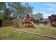 Backyard featuring a playset with climbing wall, shed, and wooden privacy fence at 434 Shepard Sw Dr, Marietta, GA 30064