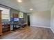 Basement office with natural light, wood laminate floors, computer setup, and view of the outdoors at 434 Shepard Sw Dr, Marietta, GA 30064