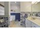 Bright bathroom featuring stylish wallpaper, white vanity, and a soaking tub at 434 Shepard Sw Dr, Marietta, GA 30064