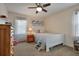 Cozy bedroom featuring a white bed frame, carpet, and a colorful gallery wall at 434 Shepard Sw Dr, Marietta, GA 30064