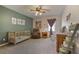 Comfortable Bedroom with soft green walls, a rocking chair, and a crib at 434 Shepard Sw Dr, Marietta, GA 30064