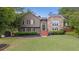 Charming two-story home with stone accents, landscaped lawn, and inviting entryway at 434 Shepard Sw Dr, Marietta, GA 30064