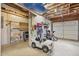 Garage with storage, peg boards, various yard tools, and ride on car at 434 Shepard Sw Dr, Marietta, GA 30064