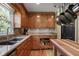 Well-organized kitchen with wood cabinets, granite countertops, tile backsplash, and modern appliances at 434 Shepard Sw Dr, Marietta, GA 30064