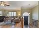 Open living room featuring hardwood floors, large windows, and a comfortable seating area at 434 Shepard Sw Dr, Marietta, GA 30064