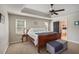 Well-lit main bedroom boasting tray ceilings, soft carpet, and neutral paint at 434 Shepard Sw Dr, Marietta, GA 30064