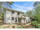 Two-story home with a brick facade and mature trees, offering a private and serene outdoor space at 539 Collingwood Dr, Decatur, GA 30032
