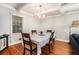 Traditional dining room featuring hardwood floors, modern lighting, and a large window at 539 Collingwood Dr, Decatur, GA 30032