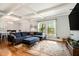 Bright living room with coffered ceilings, hardwood floors, large windows, and comfortable seating at 539 Collingwood Dr, Decatur, GA 30032