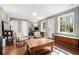 Sunlit living room featuring hardwood floors, light-colored walls, and comfortable seating area at 539 Collingwood Dr, Decatur, GA 30032