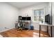Bright home office with modern desk setup, wood floors, and a large window with natural light at 539 Collingwood Dr, Decatur, GA 30032