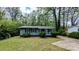 Charming single-story home with a well-maintained lawn and mature trees at 1076 Fairburn Nw Rd, Atlanta, GA 30331