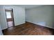 Inviting living room featuring original hardwood floors and neutral paint at 1076 Fairburn Nw Rd, Atlanta, GA 30331