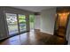 Bright living room with a front porch entrance and original hardwood floors at 1076 Fairburn Nw Rd, Atlanta, GA 30331