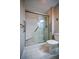 Bathroom featuring tile floors and shower with built-in seat and safety grab bars at 1800 Clairmont Lk # 221, Decatur, GA 30033