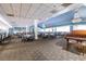Expansive dining area with tables, chairs, and a grand piano at 1800 Clairmont Lk # 221, Decatur, GA 30033