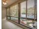 Bright living room featuring large windows with wooded views and neutral walls at 1800 Clairmont Lk # 221, Decatur, GA 30033