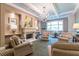 Comfortable living room with armchairs, fireplace, and elegant chandelier at 1800 Clairmont Lk # 221, Decatur, GA 30033