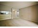 Inviting living room with neutral carpet and built-in shelving, seamlessly connected to the kitchen at 1800 Clairmont Lk # 221, Decatur, GA 30033