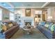 Inviting living room featuring a fireplace, built-in shelves, and comfortable seating at 1800 Clairmont Lk # 221, Decatur, GA 30033