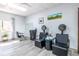A fully-equipped salon area with chairs, styling stations, and ample natural light from the large window at 1800 Clairmont Lk # 221, Decatur, GA 30033