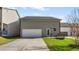 Exterior photo showcasing the backyard with a detached garage and a long driveway at 3673 Madison St, Atlanta, GA 30337