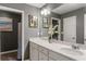Bathroom with white cabinets, sink, large mirror, and minimalist décor at 3673 Madison St, Atlanta, GA 30337