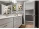 Bright bathroom features a white vanity with a modern faucet, and a view into a walk-in closet at 3673 Madison St, Atlanta, GA 30337