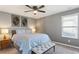 Bedroom featuring a ceiling fan, neutral walls and decor, and an accent bench at 3673 Madison St, Atlanta, GA 30337