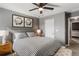 Bedroom with neutral colors, decor, ceiling fan, and an attached bathroom at 3673 Madison St, Atlanta, GA 30337