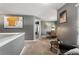 Hallway with neutral carpeting, modern artwork, and a sitting area with a black leather chair at 3673 Madison St, Atlanta, GA 30337