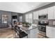 Bright kitchen features granite countertops, stainless steel appliances, and an island with bar seating at 3673 Madison St, Atlanta, GA 30337
