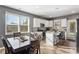 Bright kitchen with white cabinets, stainless appliances, and adjacent dining area at 3673 Madison St, Atlanta, GA 30337