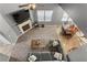 Open-concept living room with a fireplace, modern furniture, and plenty of natural light from the large window at 3673 Madison St, Atlanta, GA 30337