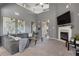 Comfortable living room with a fireplace, vaulted ceilings, and grey-toned walls at 3673 Madison St, Atlanta, GA 30337