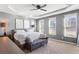 Serene main bedroom with tray ceiling, plush carpet, ample natural light, and stylish furnishings at 3673 Madison St, Atlanta, GA 30337
