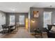 Comfortable office space with desk, chairs, and a cozy seating area near a standing floor lamp at 3673 Madison St, Atlanta, GA 30337