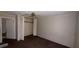 Empty bedroom with wood floors and closet at 3915 Dahlonega Hwy, Cumming, GA 30028