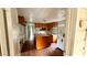 View of a kitchen with wood cabinets, white appliances and a kitchen island at 3915 Dahlonega Hwy, Cumming, GA 30028
