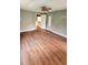 An empty living room with wood floors and gray walls at 3915 Dahlonega Hwy, Cumming, GA 30028