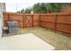 Fenced backyard with small patio, offering privacy and a cozy outdoor space at 5317 Radford Loop, Fairburn, GA 30213