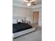 This bedroom features neutral tones, a comfortable bed, and two nightstands at 5317 Radford Loop, Fairburn, GA 30213