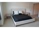 This bedroom features neutral tones, a comfortable bed, and two nightstands at 5317 Radford Loop, Fairburn, GA 30213