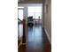 View of dining area and stairs featuring hardwood floors and lots of natural light at 5317 Radford Loop, Fairburn, GA 30213