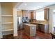Modern kitchen boasting stainless steel appliances, a center island, and ample cabinet space at 5317 Radford Loop, Fairburn, GA 30213